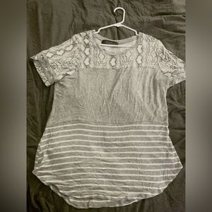 Grey and white t-shirt with 3 different patterns on it, size 1x